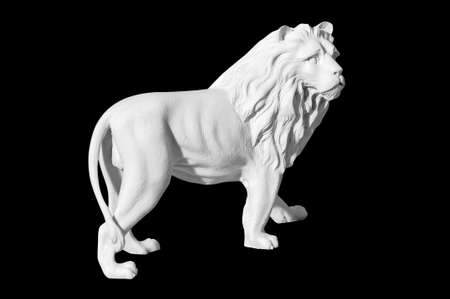 Classical marble statue of a lion on a black backgroundの写真素材