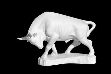 statue of a bull on a black backgroundの写真素材