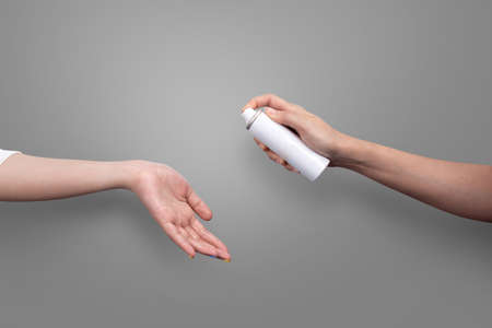 Close-up applying hand sanitizer to clean and disinfect hands, clipping path Isolated.の写真素材