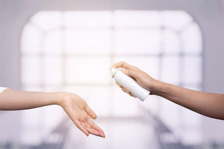 Many hands holding a blank big paper for advertisingの写真素材