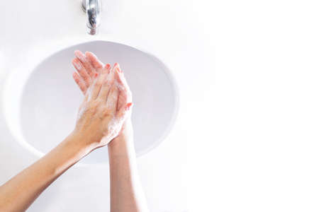 Close up of woman washing her hands Sinks top view.の写真素材