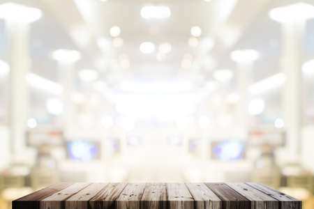 Wood table in factory building blurred background
