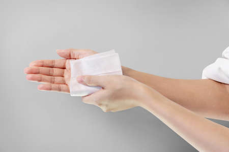 Woman cleaning her hand wet wipe, Healthcare and medical concept.