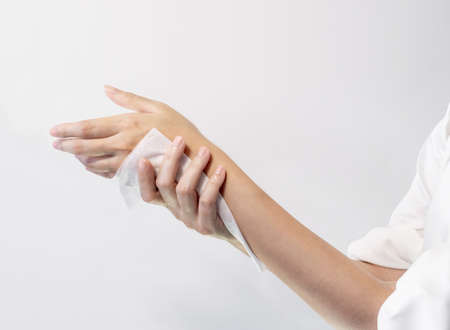 Woman cleaning her hand wet wipe, Healthcare and medical concept.の写真素材