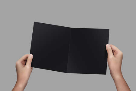 Hands holding paper blank a4 size for letter paper.の写真素材