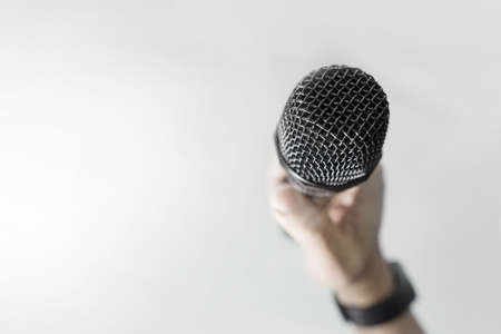 Close up of hand holding microphoneの写真素材