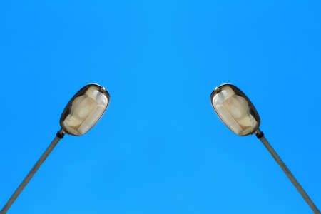 Street light against a blue skyの写真素材