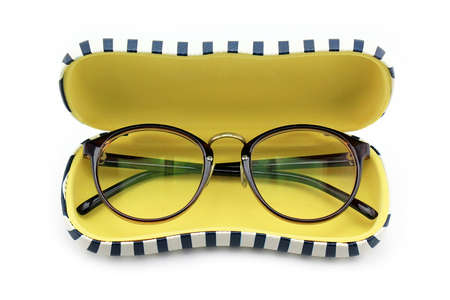 Vintage nerd glasses in the leather case over white, clipping path, Classic eyeglasses.の写真素材