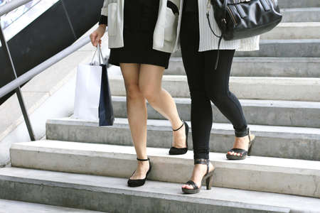 Shopping lover, Women holding shopping bags on the street, Let's go shopping, Shopaholic women.の写真素材