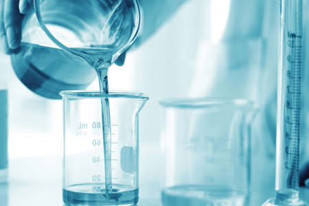 Oil pouring, Equipment and science experiments, Formulating the chemical for medicine, Organic pharmaceutical, Alternative medicine concept. (Selective Focus)の写真素材