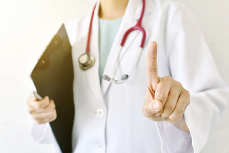 Doctor hand pointing on empty space, Doctor hand touching empty virtual screen.の写真素材