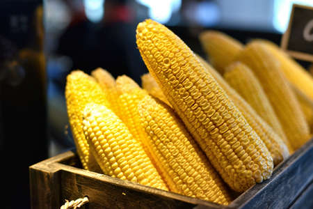 Fresh corn on the basket in restaurant.の写真素材