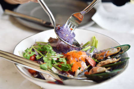 Spicy seafood noodle salad, Glass vermicelli noodle with shrimp, pork and mussel salad(Yum Woon Sen), Thai  famous appetizer.の写真素材