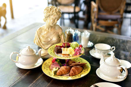 Afternoon English high tea set, Croissant and cake.の写真素材