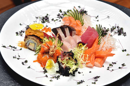 Japanese food, Fresh fish sashimi and rice roll, Raw healthy food.の写真素材