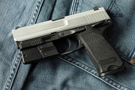 Semi-automatic handgun on carpet background, 9mm pistol.の写真素材