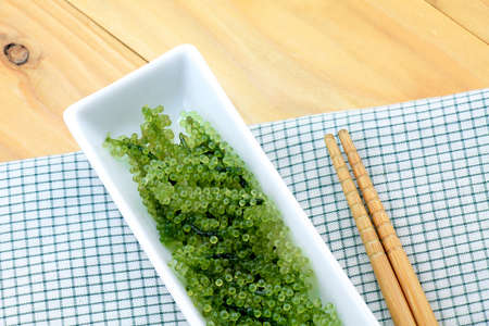 Seaweed Salad, Healthy sea food in the dish. Oval grapes seaweed. Healthy Food.の写真素材