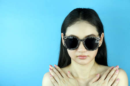 Fashion portrait of beautiful sensual girl with bright makeup, Beautiful fashion photo of young magnificent woman with sunglasses.の写真素材