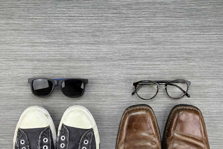 Different Style of men fashion, Compare of formal and casual fashion style, Sneakers, Leather Shoes, Sunglasses, Nerd Glasses. (Color Process)の写真素材