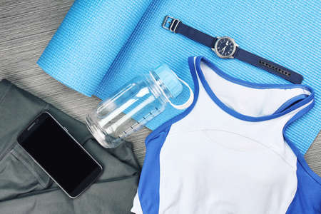 Women's sport wear, Gym fashion and accessories, Exercise Equipment, Healthy lifestyle concept, Yoga Mat, Sport water bottle.の写真素材