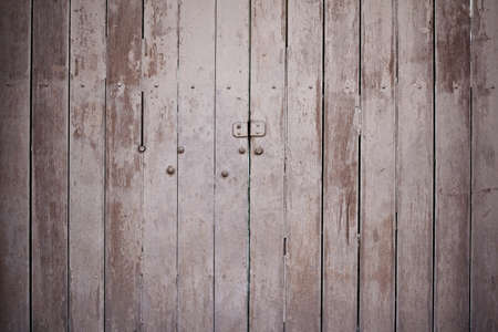 Old wooden gate with faded paint, Vintage wooden door.の写真素材