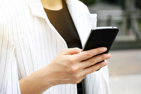Business woman using a smart phone.の写真素材