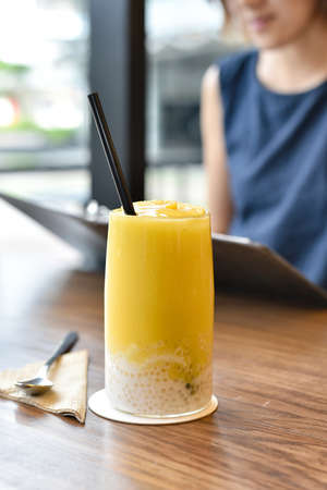 Refreshing mango juice smoothies drink, Mango fruit dessert with jelly, Resting in lifestyle cafe.の写真素材