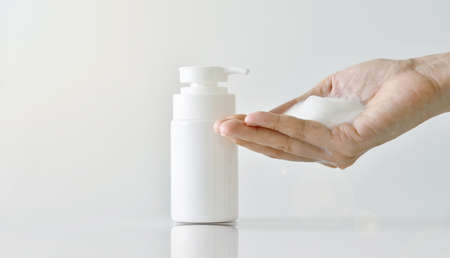 Hand pumping cleansing foam, Face cleanser, Cosmetics foam pump container.の写真素材