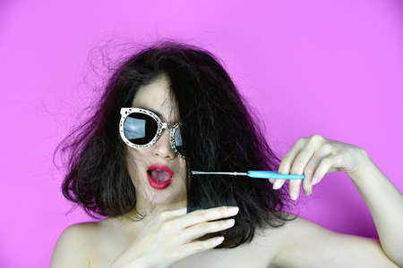 Hair damaged, Woman cutting her dry messy hair, Hair problem.の写真素材