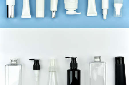 Collection of cosmetic bottle containers, Blank label for branding mock-up, Flat lay on color background.の写真素材