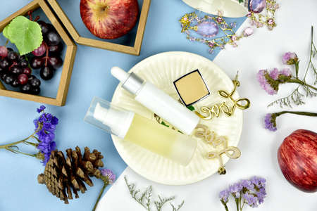 Cosmetic bottle containers with fruit vitamin essence ingredients, Blank label for branding mock-up, Natural beauty product concept.の写真素材