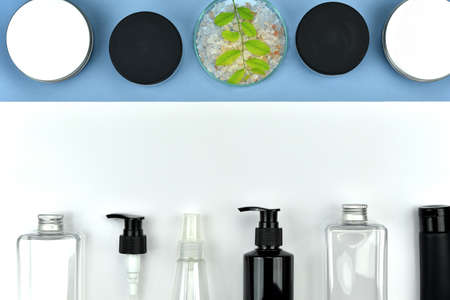 Collection of cosmetic bottle containers, Blank label for branding mock-up, Flat lay on color background.の写真素材