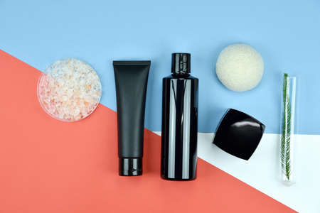 Cosmetic bottle containers, Blank label for branding mock-up, Flat lay on color background.