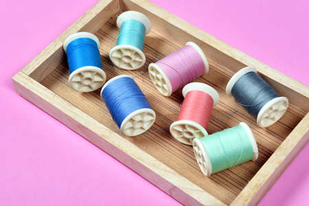 Thread rolls, Group of colorful thread on sewing desk, Craft, sewing and needlework concept.
