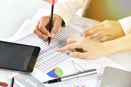 Business strategy planning, Business women discuss and review paperwork data documents, Business...
