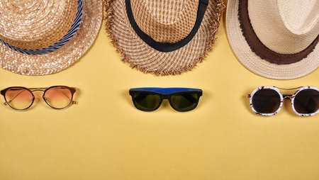 Summer accessories and fashion, Set of sunglasses and straw hats, Different type of style comparison.の写真素材