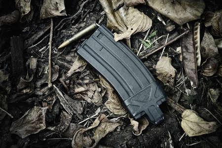 Gun magazine, Weapons and military equipment for army, Assault rifle gun magazine (M4A1) on dry...
