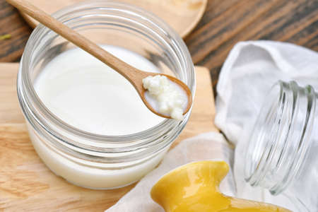 Kefir milk, Close up of hand holding kefir grains, Healthy fermented food, Probiotic nutrition drink for good balance digestive system.の写真素材