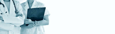 Doctor and nurse in uniform, Hospital background and Healthcare staff, Professional medical care provider with copy space for an advertising cover picture.の写真素材