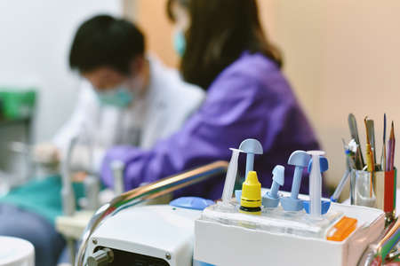 Dental care equipment, Background of dentist examining and doing teeth treatment in dental clinic, Yearly visit for teeth cleaning and scaling to prevent gum disease problems.の写真素材