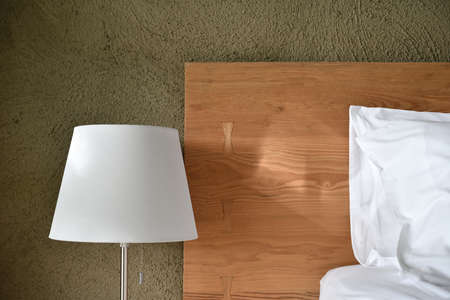 Modern and loft bedroom minimal style, Close up of headboard and night lamp.の写真素材