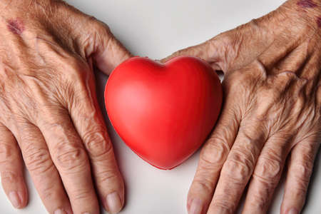 Elderly care concept, Senior people holding red heart to help and support, Family take care and...