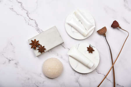 Cosmetic bottle containers on marble background, Blank label package for branding mock-up, Natural organic beauty product concept, Research and development of purified botany skincare.の写真素材