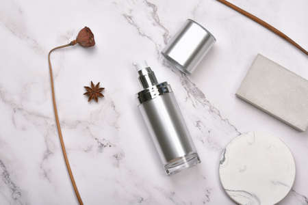 Cosmetic bottle containers on marble background, Blank label package for branding mock-up, Natural organic beauty product concept, Research and development of purified botany skincare.の写真素材