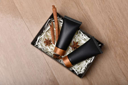 Cosmetic black bottle containers packaging with cinnamon and anise aromatherapy oil essence extract, Blank label for organic herb branding mock-up, Natural skincare beauty product concept.の写真素材