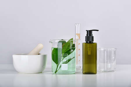 Natural skincare beauty product research, Organic botany extraction in scientific glassware at...