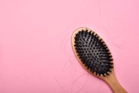 Dirty hair brush, Grey lint dead skin cell residue on unclean comb, Poor hygiene head scalp, Hair fall problem.の写真素材