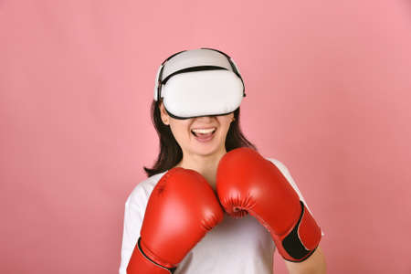 Asian woman using vr glasses, Working out with boxing video games application from virtual reality...