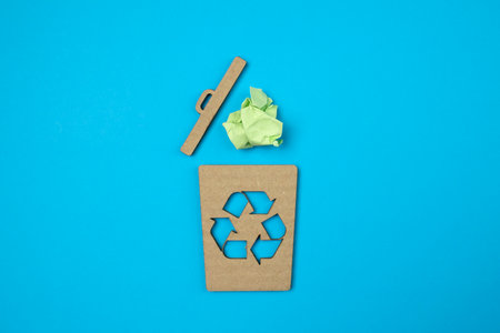 Cardboard garbage bin of reuse, reduce, recycle symbol with free copy space for creativity ideas...