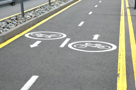 The bicycle lane symbol indicated the road for bicycles. The bicycle sign. Close up.
